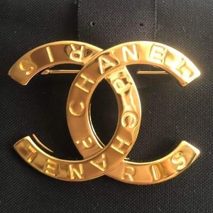 Author Chanel gold brooch.  BNIB full set